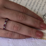 Ruby and diamond ring in 18k white gold with 4 rubies and 5 diamonds.
