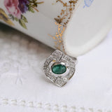 Art-déco-Ring mit zentralem Smaragd