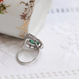 Art-déco-Ring mit zentralem Smaragd