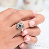 Vintage platinum ring with oval sapphire and round cut diamonds.