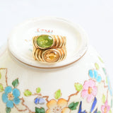 Band citrine and peridot ring