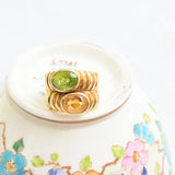 Band citrine and peridot ring