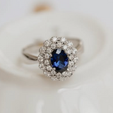 Vintage sapphire ring with two halo of diamonds