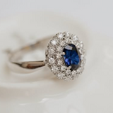 Vintage sapphire ring with two halo of diamonds