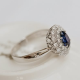 Vintage sapphire ring with two halo of diamonds