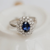 Vintage sapphire ring with two halo of diamonds