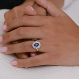 Vintage sapphire ring with two halo of diamonds