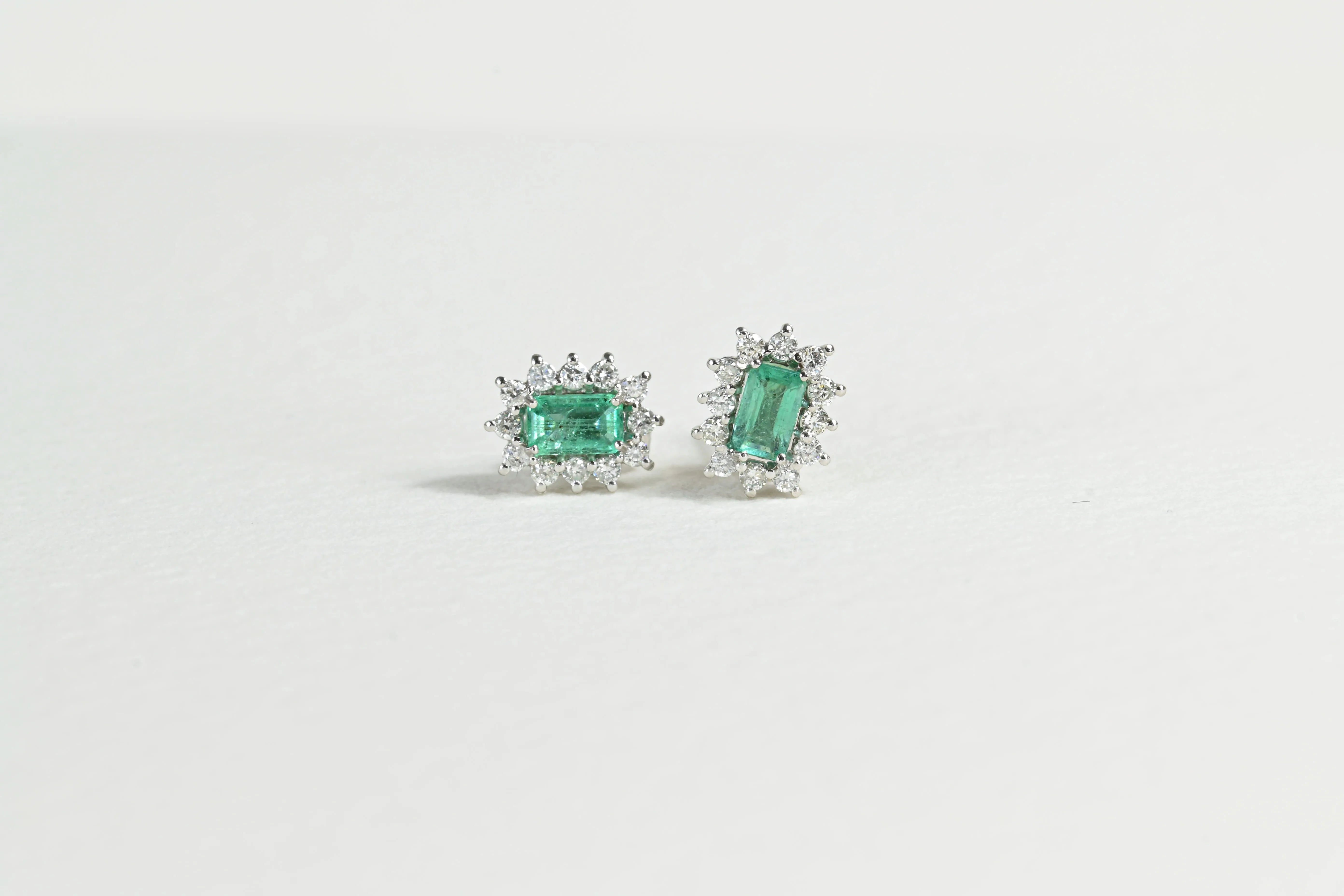 Emerald Earrings with a Halo of 12 Diamonds