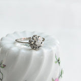 Vintage solitaire ring in round flower setting