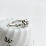Vintage solitaire ring in round flower setting