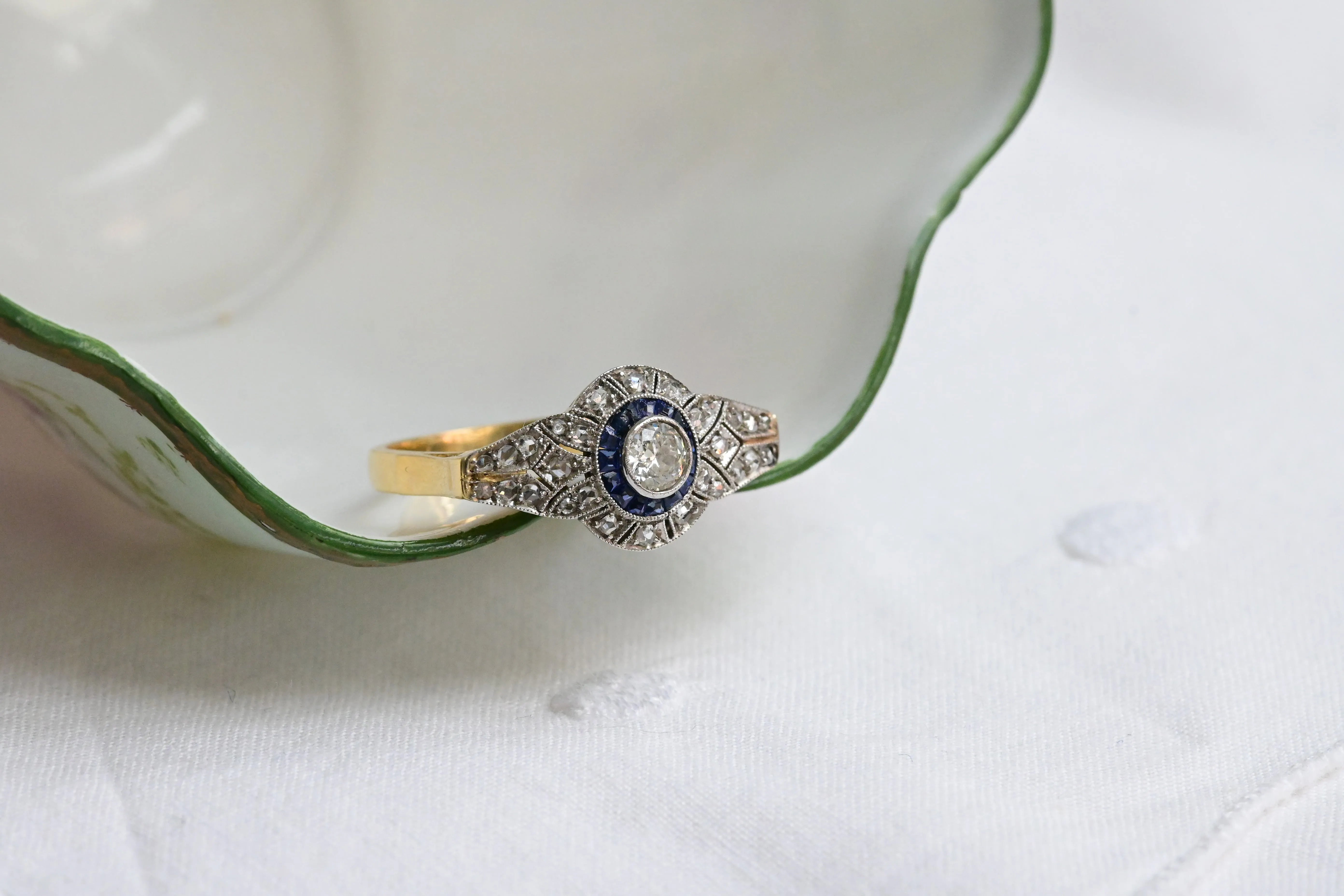 Art deco target ring with sapphire and diamonds