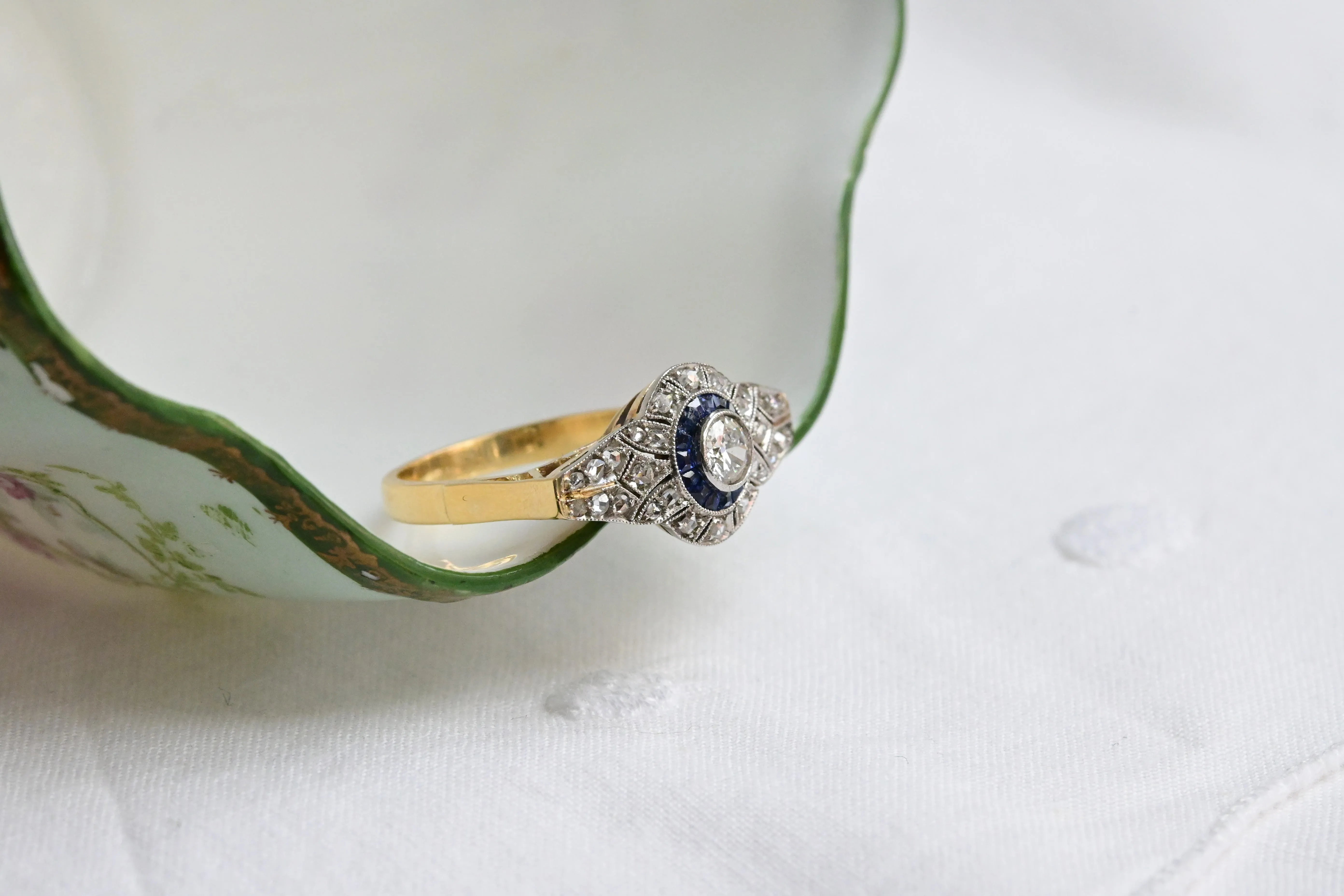 Art deco target ring with sapphire and diamonds