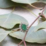 Vintage cocktail ring with emeralds and diamonds.