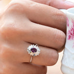 Vintage Ring with Central Oval Purple Sapphire and 10 Octagonal Cut Diamonds in 18K White Gold