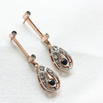 Boucles d'oreilles vintage avec 14 diamants anciens en taille rose et 2 saphirs ronds, en or rose 14K et argent.