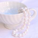 Vintage Edison white pearls necklace with hidden white gold clasp.