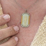 Art deco necklace with religious motif carved in mother of pearl