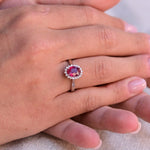 Vintage Pink Ruby Ring with a halo of 18 diamonds.