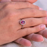 Vintage Pink Ruby Ring with a halo of 18 diamonds.