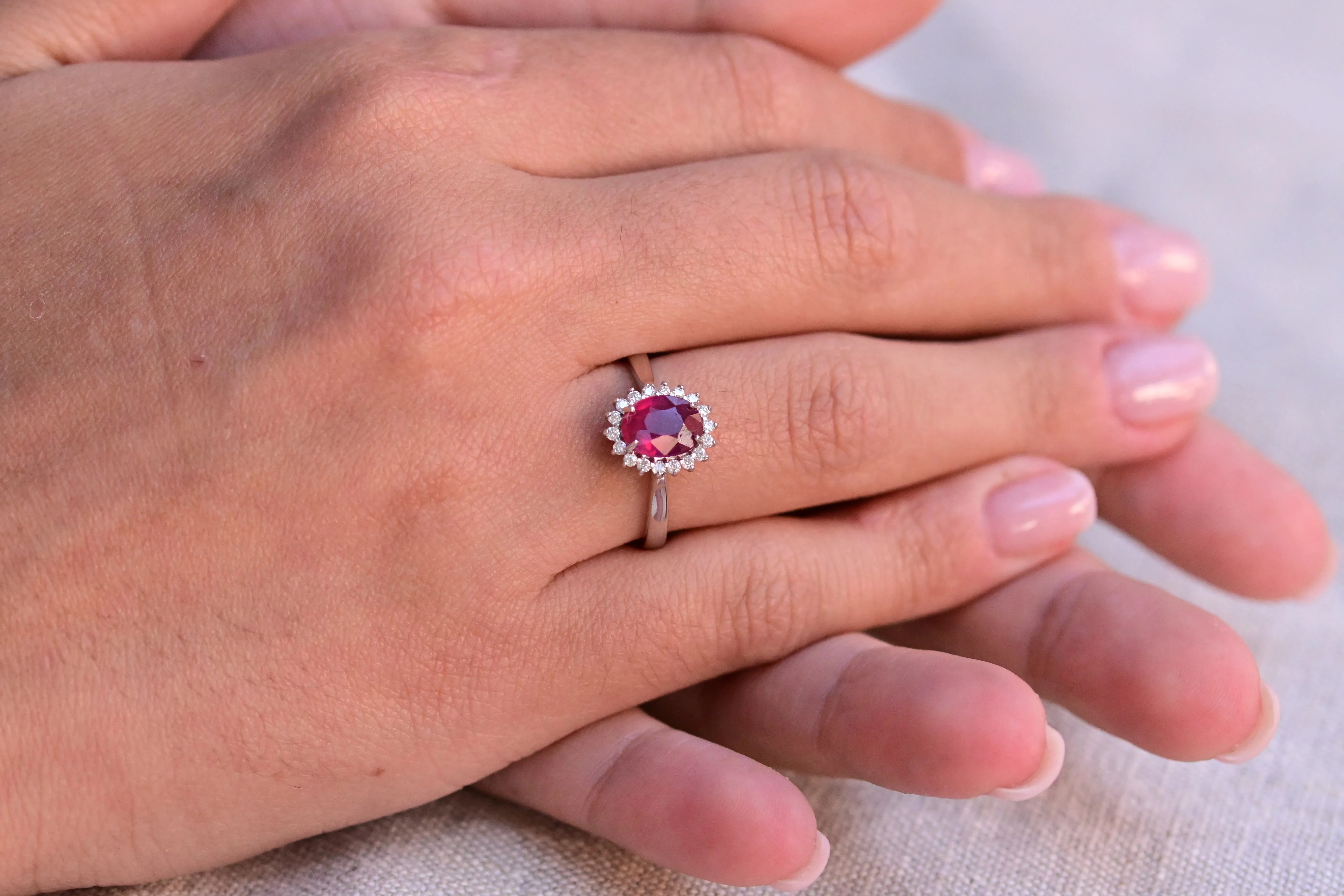 Vintage Pink Ruby Ring with a halo of 18 diamonds.