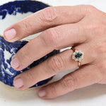 Vintage Entourage Ring with a Central Sapphire and Surrounded by Diamonds