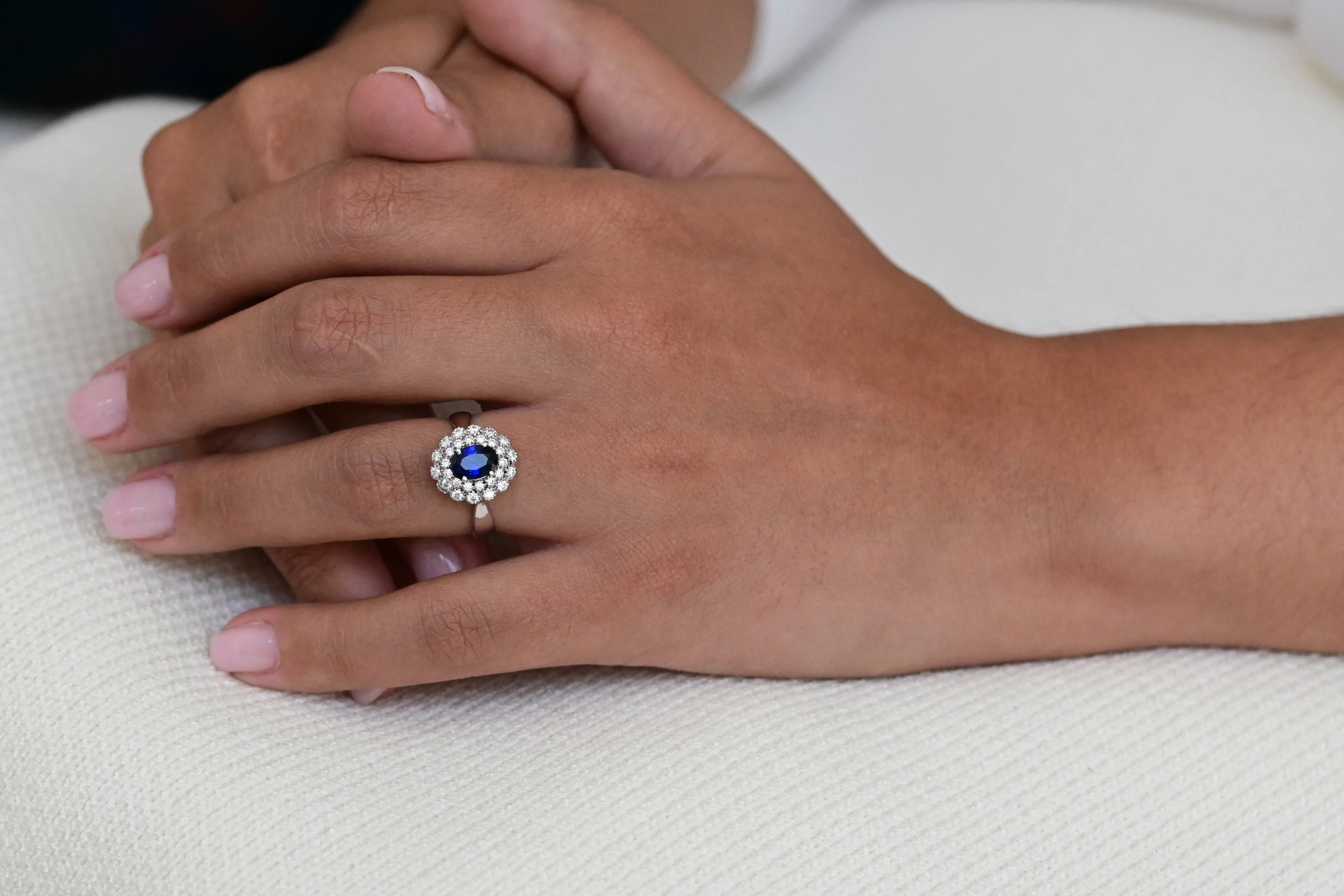 Vintage Engagement Ring with a Central Sapphire and Halo of Diamonds