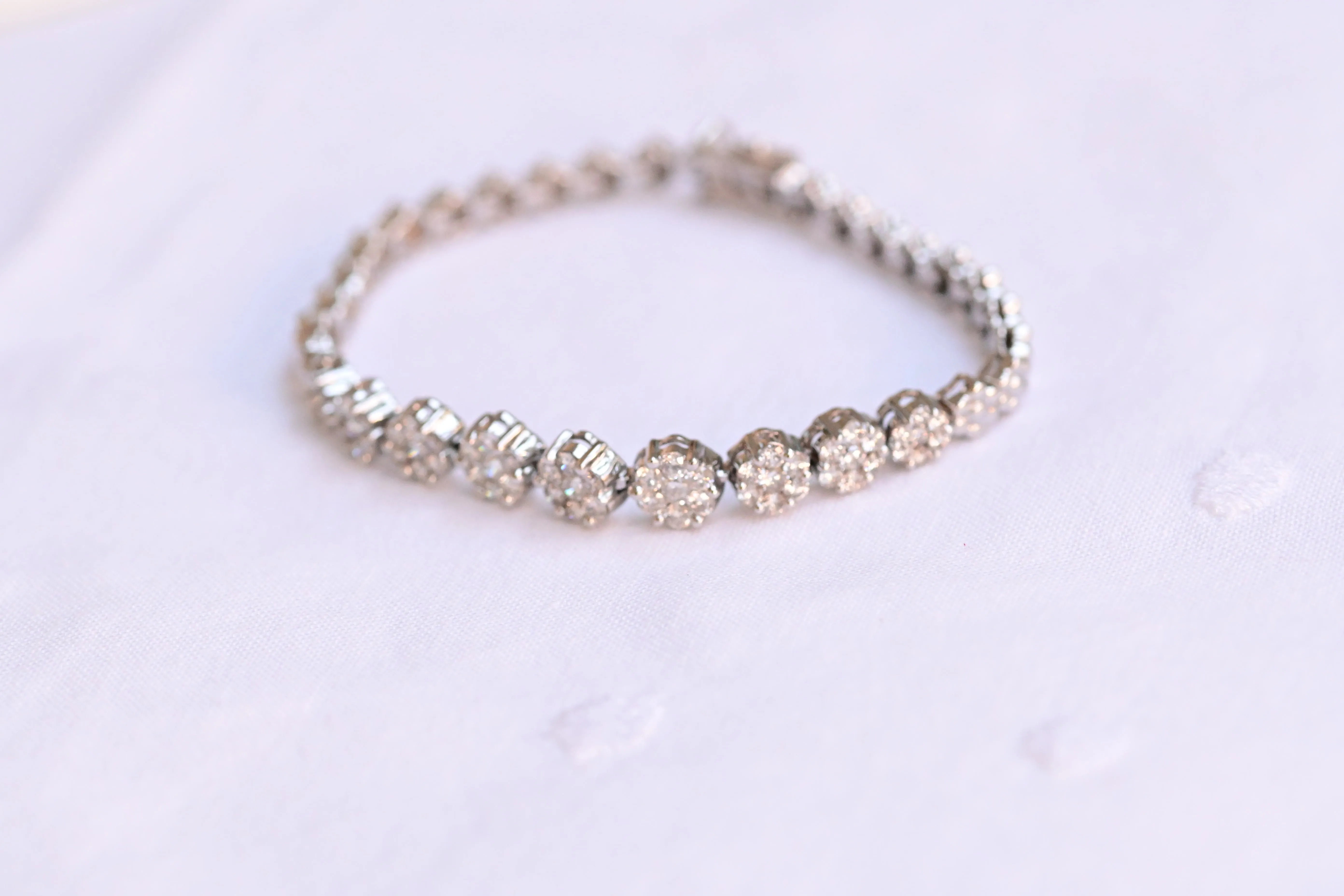 Close-up of the vintage flower bracelet showing the 63 diamonds set in 14K white gold.