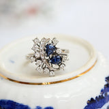 White gold cocktail ring with blue-violet pear-cut sapphires and diamonds