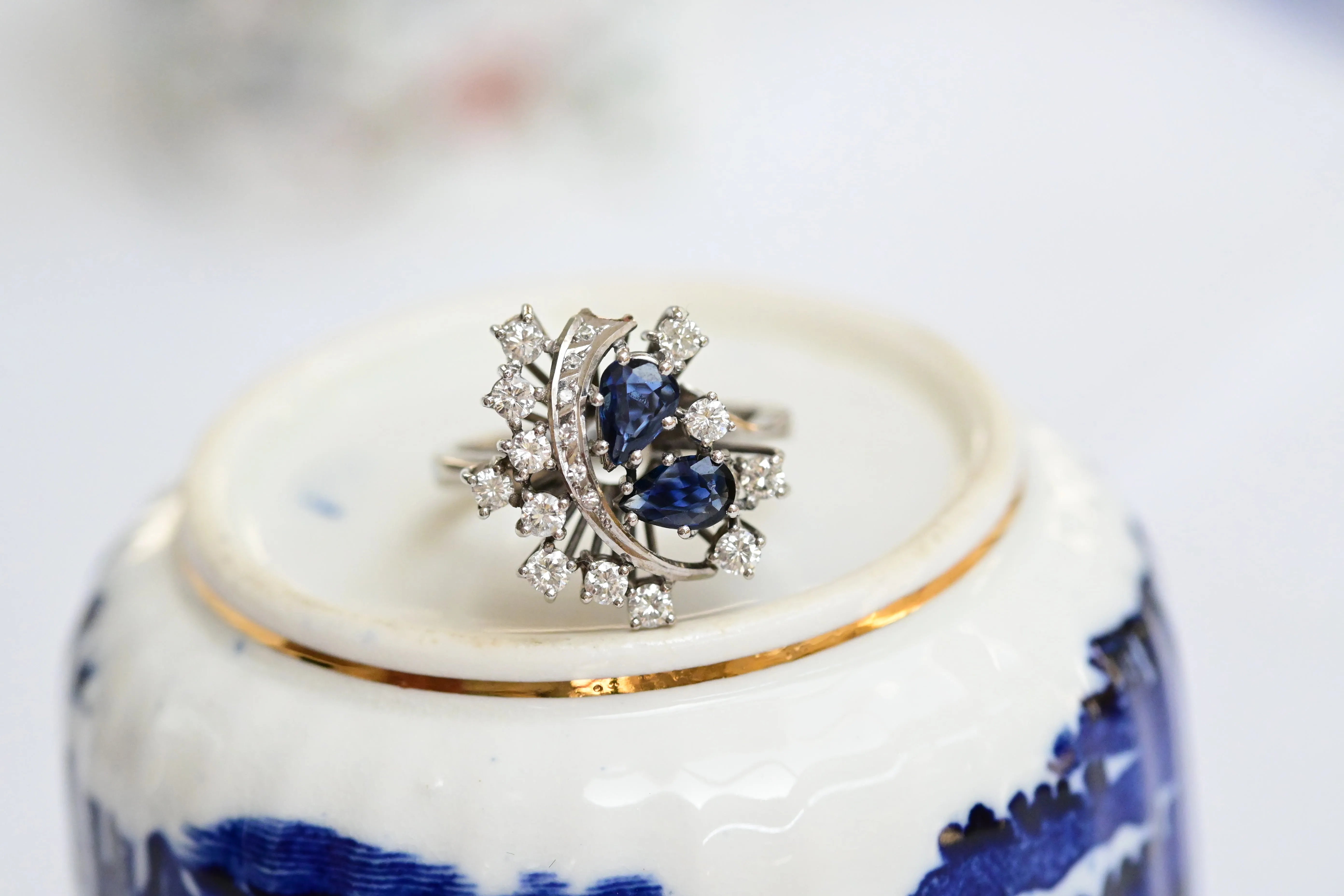 White gold cocktail ring with blue-violet pear-cut sapphires and diamonds