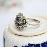 Cocktail ring featuring pear-cut blue-violet sapphires and diamonds