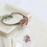 Trinity ring with fancy vivid orange diamonds