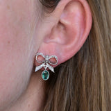 Ribbon earrings, with light deep green emeralds and diamonds