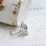 Art deco ring with central emerald