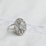 Bague vintage avec aigue-marine centrale et diamants