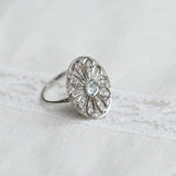 Bague vintage avec aigue-marine centrale et diamants